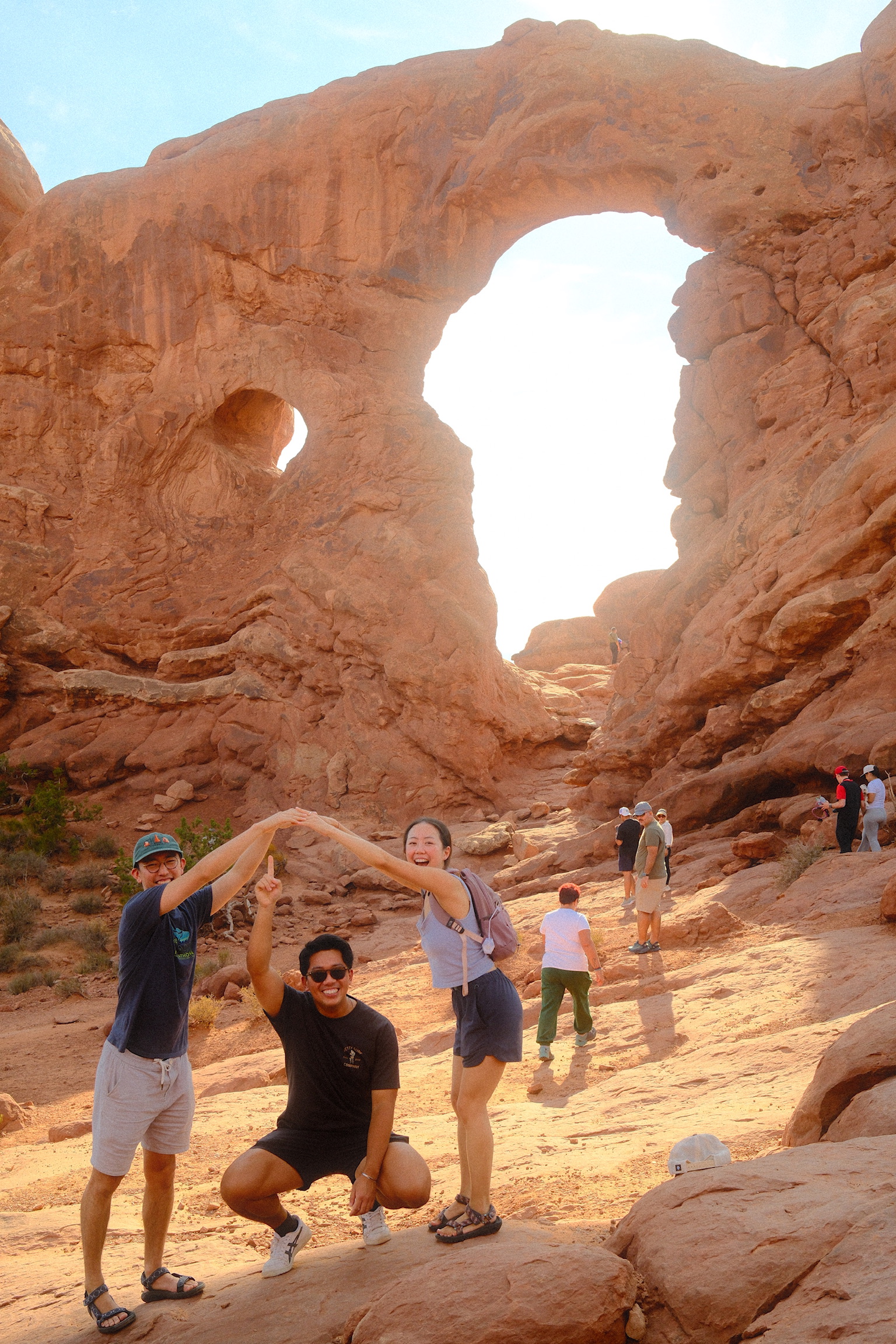 Friends posing under Turret Arch